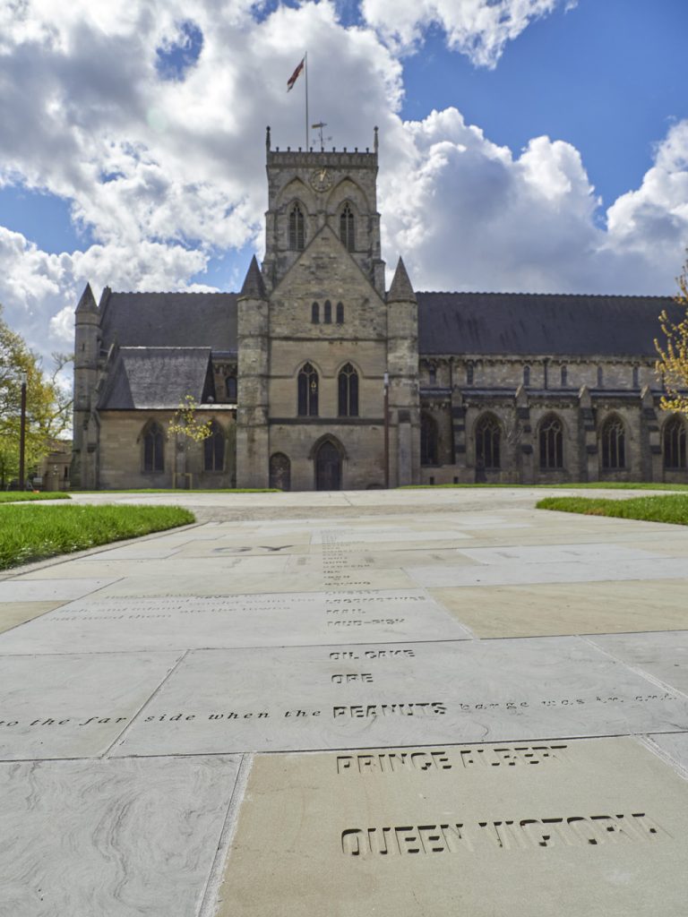 'come follow me' - a 30m long text artwork in saint james square outside grimsby minster.